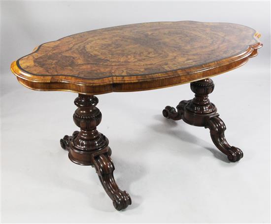 A Victorian burr walnut serpentine shape centre table, W.5ft 1in.